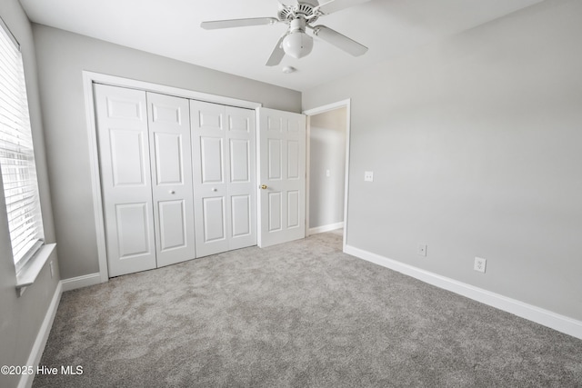 1422 Willoughby Park Ct Unit 5, Wilmington, NC 28412 - unfurnished bedroom featuring carpet, a closet, baseboards, and a ceiling fan
