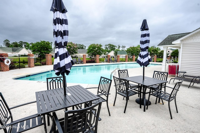1422 Willoughby Park Ct Unit 5, Wilmington, NC 28412 - community pool featuring a patio area and outdoor dining area