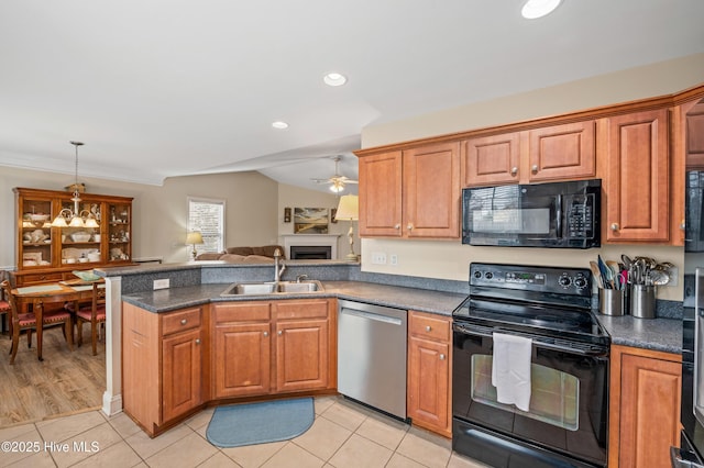 kitchen featuring kitchen peninsula, light tile patterned floors, sink, and black appliances