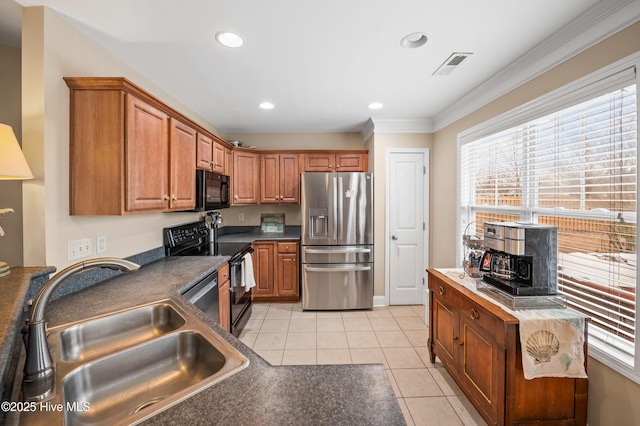 kitchen with light tile patterned floors, sink, ornamental molding, and black appliances