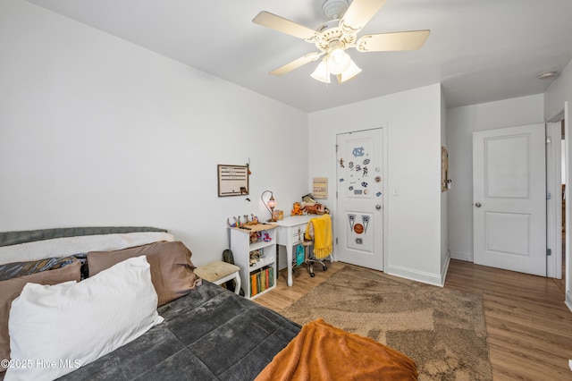 bedroom featuring hardwood / wood-style flooring and ceiling fan