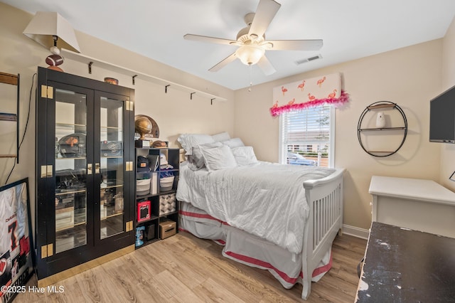 bedroom featuring ceiling fan and hardwood / wood-style floors