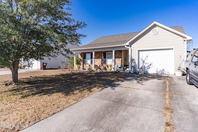 ranch-style home with a porch and a garage