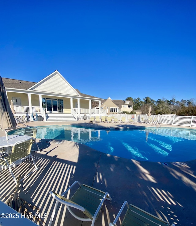 view of swimming pool with a patio area