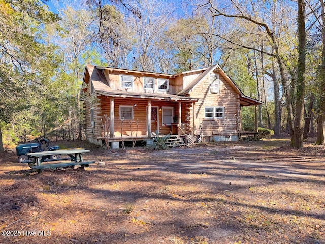 log cabin featuring a porch