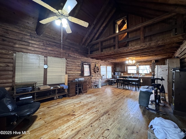 living room with beamed ceiling, log walls, hardwood / wood-style flooring, high vaulted ceiling, and ceiling fan