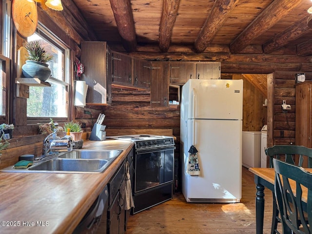 kitchen featuring wood ceiling, black / electric stove, beamed ceiling, white fridge, and sink