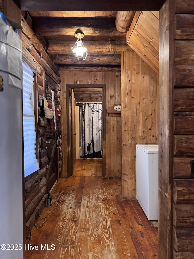 corridor featuring wood-type flooring, wood walls, vaulted ceiling with beams, and wood ceiling