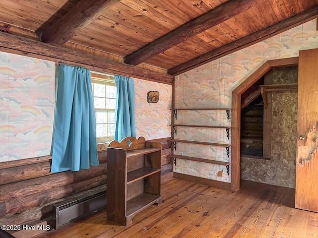 interior space featuring wooden ceiling, hardwood / wood-style flooring, and beamed ceiling