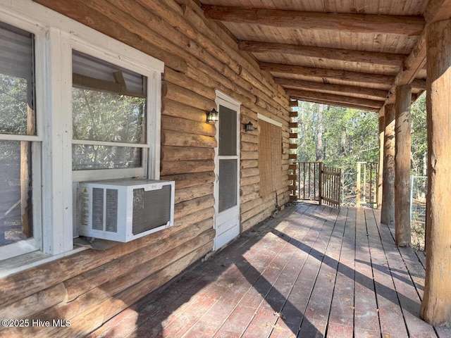 deck featuring cooling unit and a porch