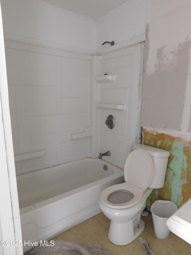 bathroom with toilet, tub / shower combination, and tile patterned flooring