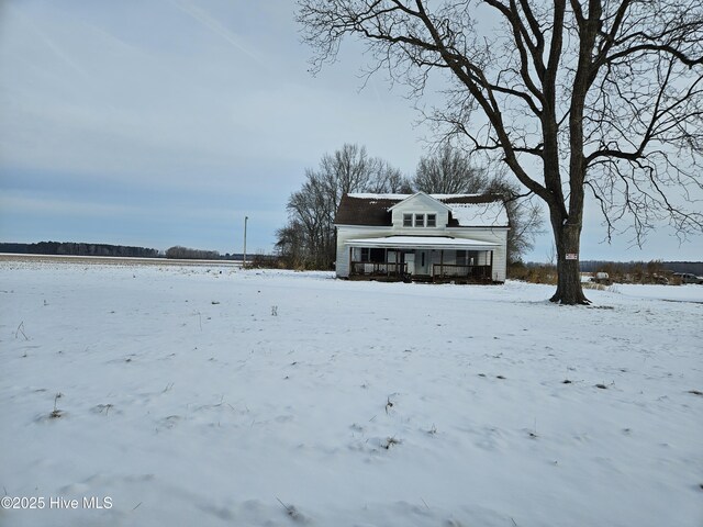 view of yard with covered porch