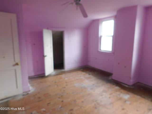 bonus room with ceiling fan and lofted ceiling