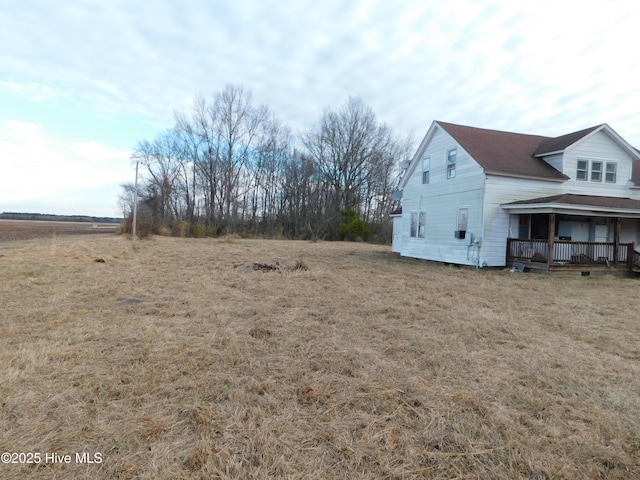 view of yard with covered porch