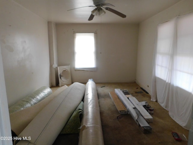 interior space with ceiling fan