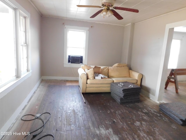 sitting room with ceiling fan, ornamental molding, plenty of natural light, and dark hardwood / wood-style flooring