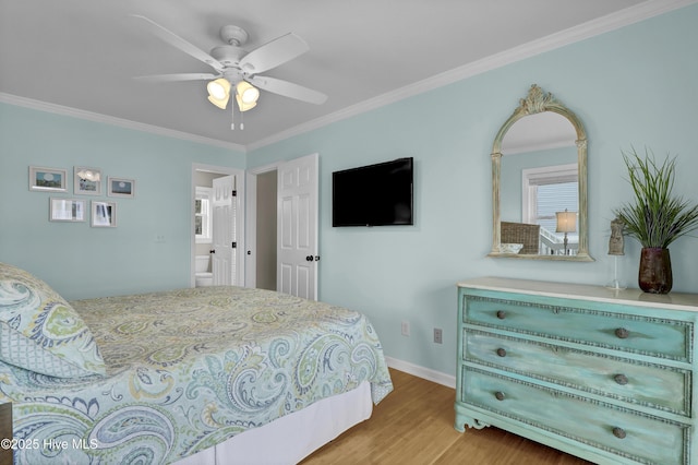 bedroom featuring ceiling fan, light hardwood / wood-style floors, and crown molding