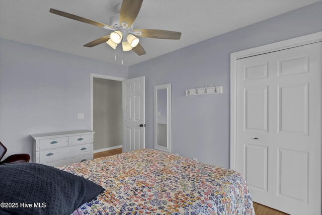 bedroom with a closet, ceiling fan, and light hardwood / wood-style floors