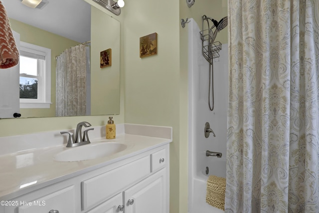 bathroom with shower / bathtub combination with curtain and vanity