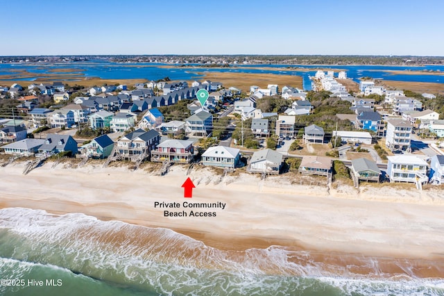 bird's eye view with a view of the beach and a water view