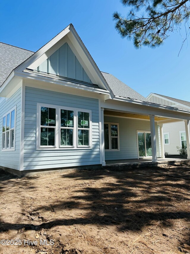 view of side of property featuring a porch