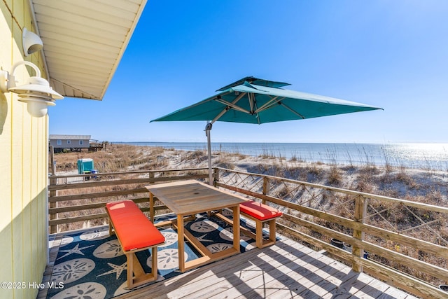 wooden deck featuring a water view