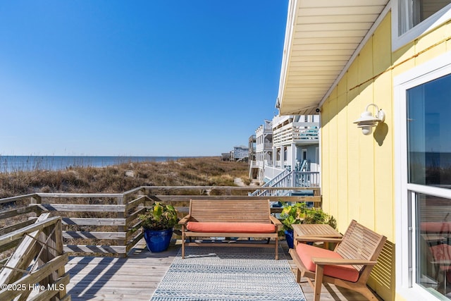 balcony featuring a water view