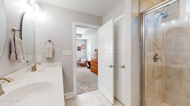 bathroom featuring vanity and a shower with door