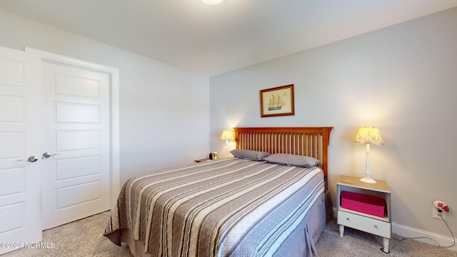 bedroom with light carpet