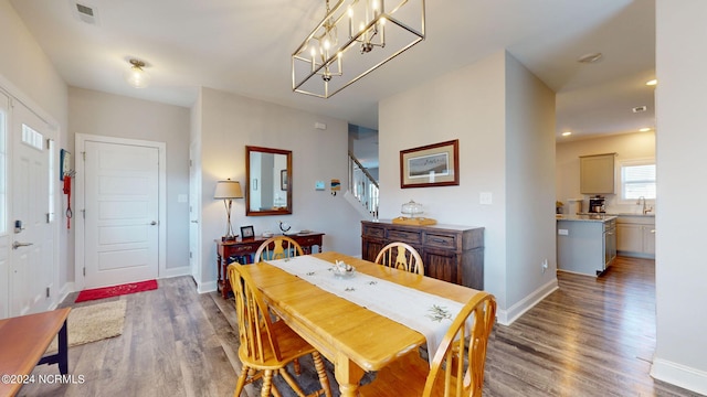 dining room featuring hardwood / wood-style flooring and sink