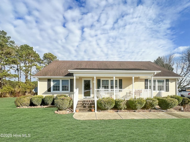 ranch-style home with covered porch and a front yard