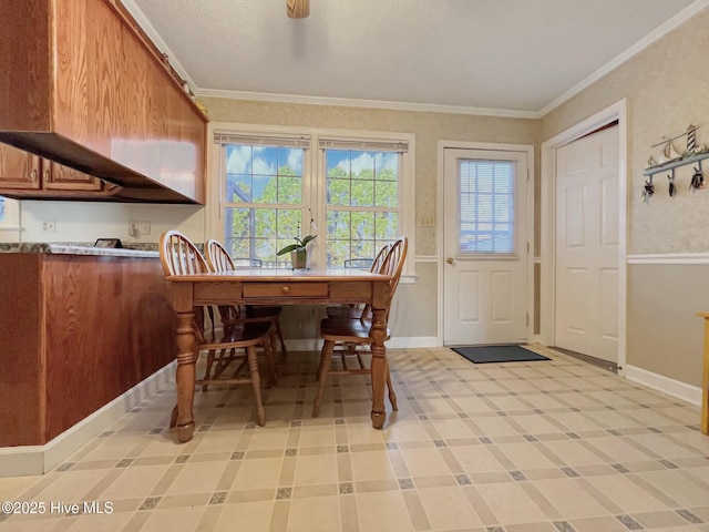 dining space with ceiling fan and ornamental molding