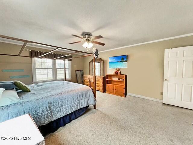 bedroom featuring carpet flooring and ceiling fan