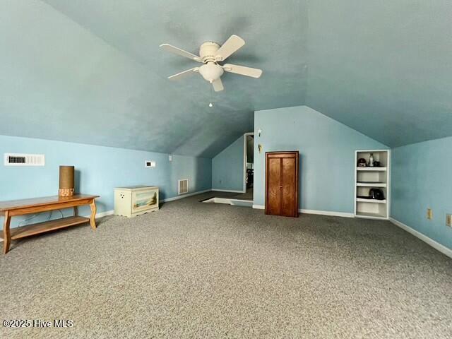 bonus room featuring carpet floors, vaulted ceiling, and ceiling fan