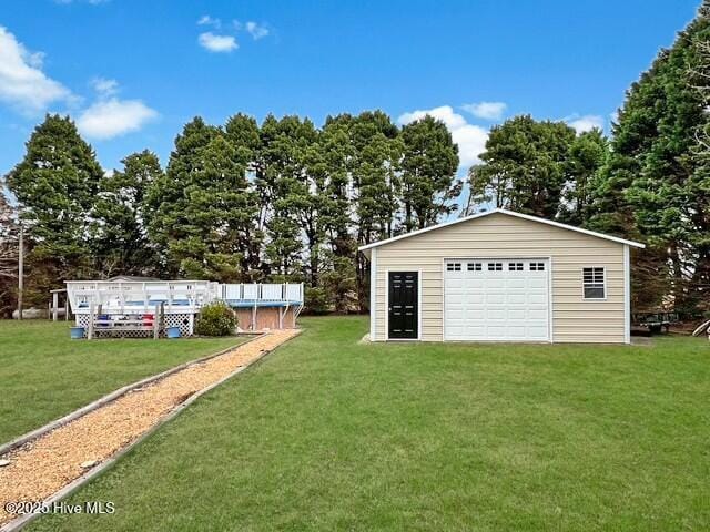 garage featuring a yard