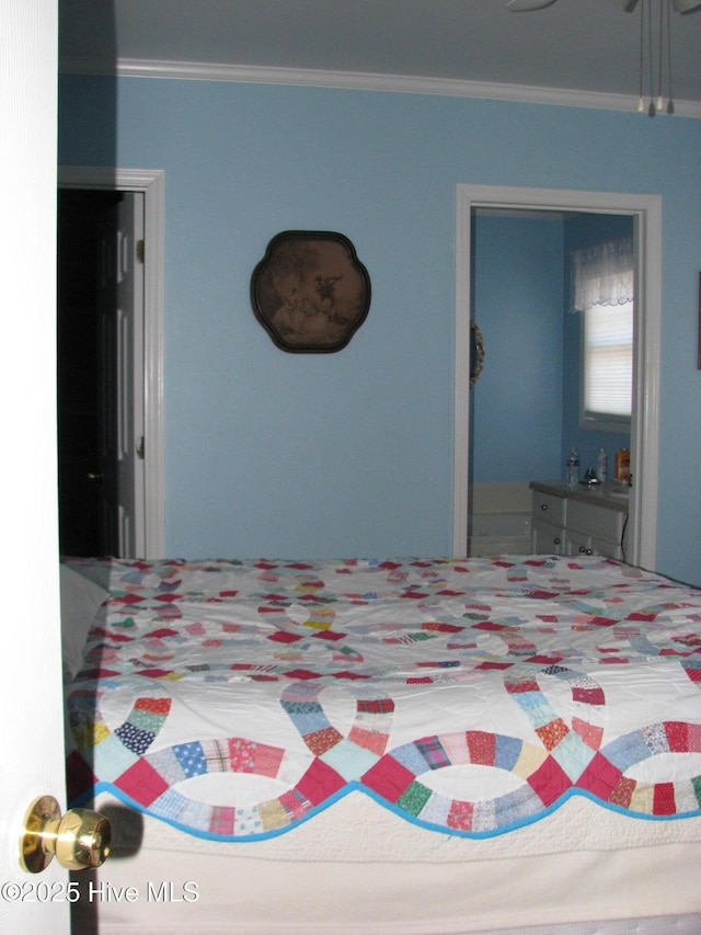 bedroom with ceiling fan and ornamental molding