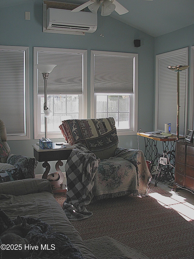 living room with ceiling fan, lofted ceiling, carpet floors, and a wall unit AC