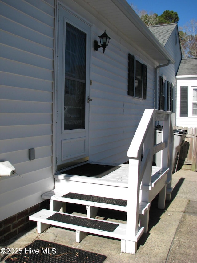 property entrance with a wooden deck