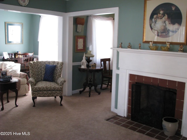 interior space featuring a fireplace and carpet floors