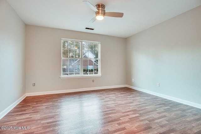 unfurnished room with ceiling fan and light hardwood / wood-style floors