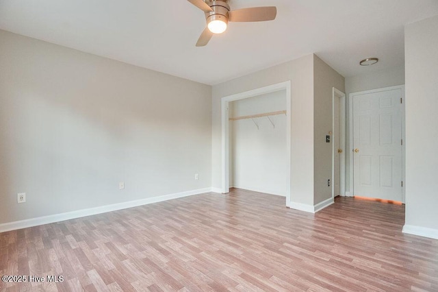 unfurnished bedroom with ceiling fan, a closet, and light hardwood / wood-style flooring