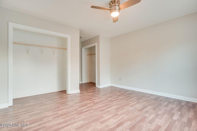 unfurnished bedroom with a closet, light hardwood / wood-style flooring, and ceiling fan