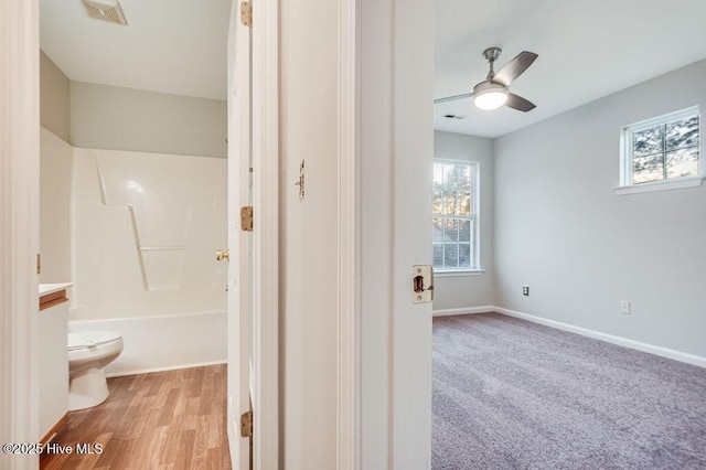 full bathroom featuring ceiling fan, toilet, shower / bath combination, and vanity