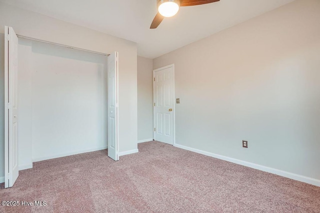 unfurnished bedroom featuring carpet flooring, ceiling fan, and a closet