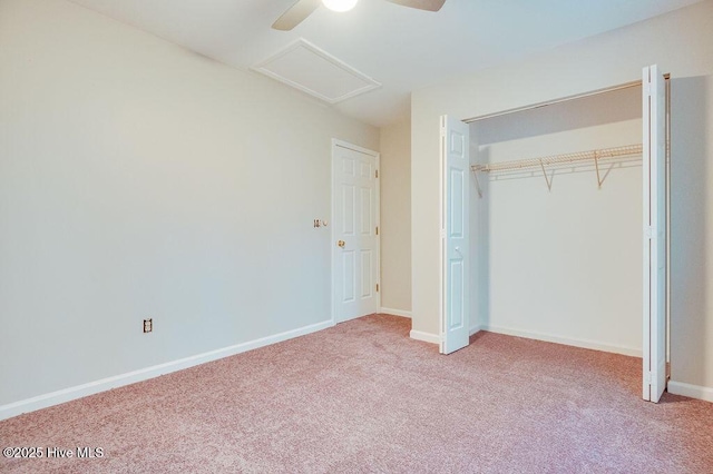 unfurnished bedroom with ceiling fan, a closet, and carpet floors