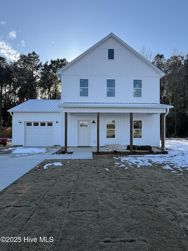 modern farmhouse style home with a garage and a porch