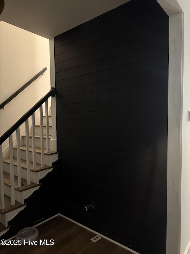 stairway featuring hardwood / wood-style flooring