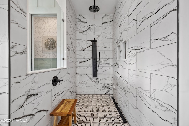 bathroom with a tile shower