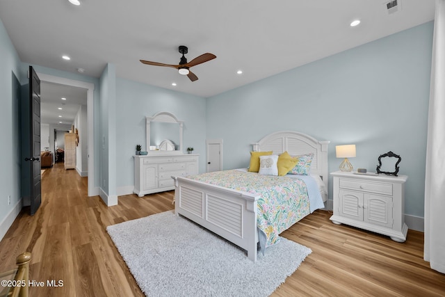 bedroom featuring ceiling fan and light wood-type flooring