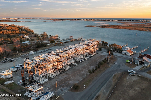 aerial view at dusk with a water view